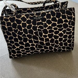 Vintage Black and white animal print handbag with snap closure, inside pocket.